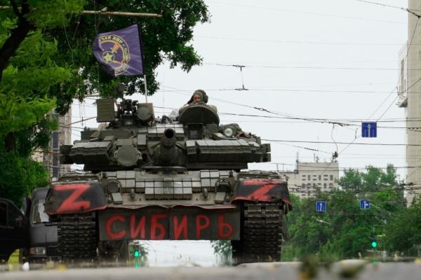 Wagner Group mercenaries sit atop a tank in the city of Rostov-on-Don, Russia, on June 24, 2023. (Stringer/AFP/Getty Images)