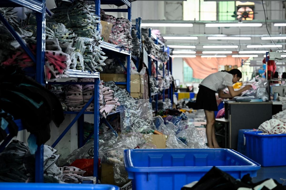 A worker makes clothes at a garment factory that supplies Shein, a cross-border fast fashion e-commerce company in Guangzhou, Guangdong Province, China, on July 18, 2022. (Jade Gao/AFP via Getty Images)