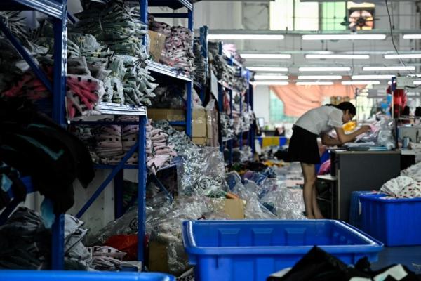 A worker makes clothes at a garment factory that supplies SHEIN, a cross-border fast-fashion e-commerce company in Guangzhou, in China's southern Guangdong Province, on July 18, 2022. (Jade Gao/AFP via Getty Images)