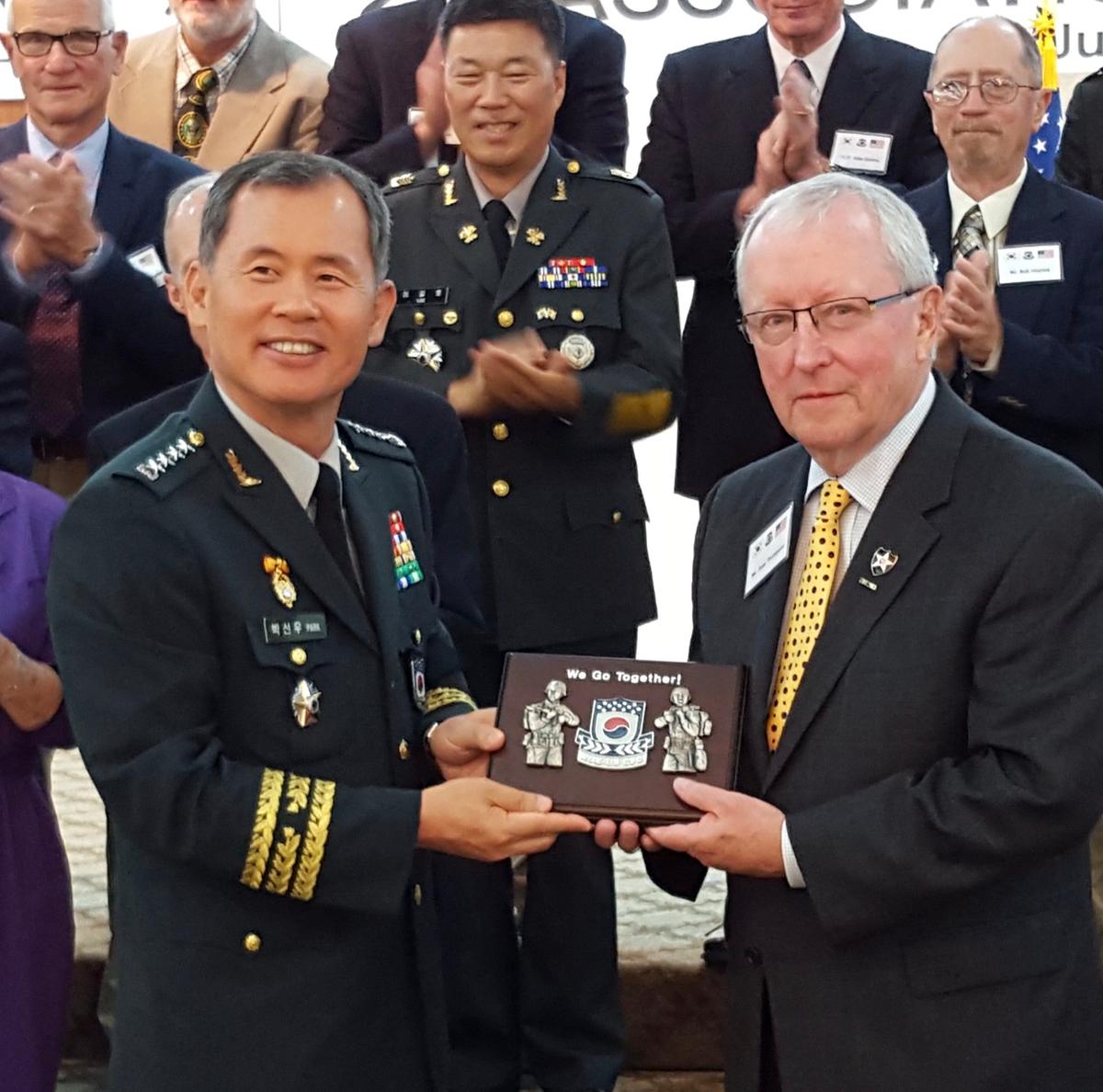 Aves Thompson receiving an award from the Deputy Commander of Combined Forces Command (CFC) of U.S. Forces Korea in 2015. (Courtesy of Aves)