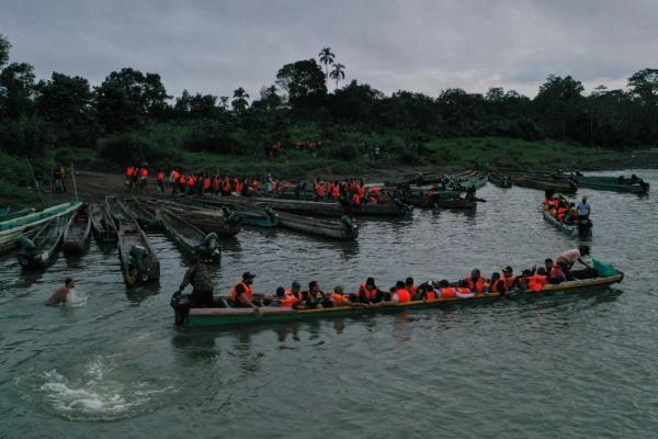 Migrants headed for the United States travel through the jungle in Darien Province, Panama, on Oct. 13, 2022. (Luis Acosta/AFP via Getty Images)