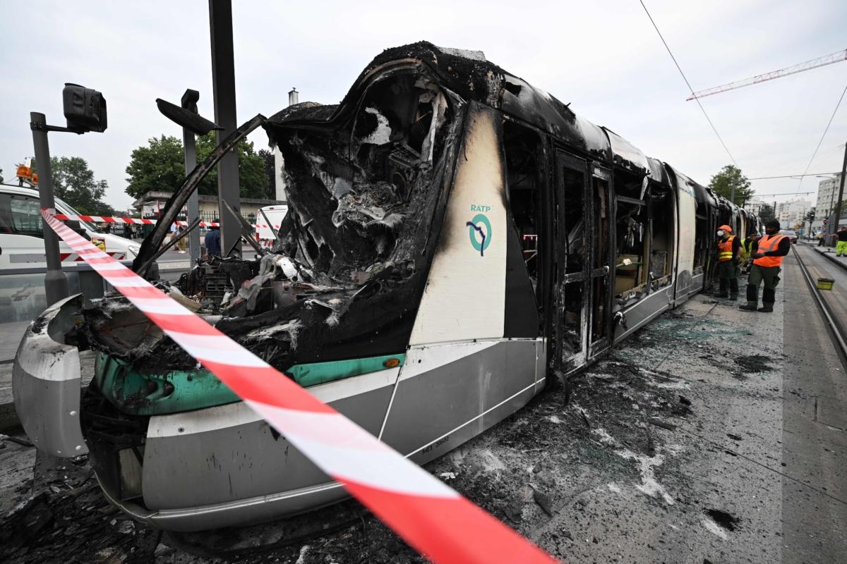 This photograph taken on June 29, 2023, in Clamart, southwest of Paris, shows a burned tram following violence and protests in the suburb the previous night in reaction to a police-involved shooting. (Emmanuel Dundand/AFP via Getty Images)