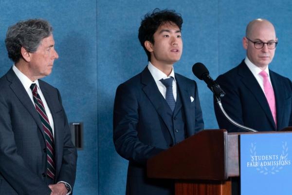 Berkeley University student Calvin Yang (C), flanked by Edward Blum (L) and Adam Mortaraw (R), speaks during a news conference on Supreme Court affirmative action in college admissions decision at the Press Club in Washington on June 29, 2023. (Jose Luis Magana/AP Photo)