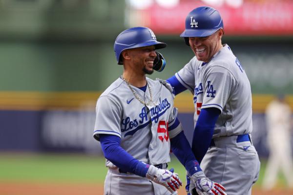 Mookie Betts (50) of the Los Angeles Dodgers is congratulated by Freddie Freeman (5) of Fountain Valley, Calif., following a home run against the Milwaukee Brewers during the first inning at American Family Field in Milwaukee on May 9, 2023. (Stacy Revere/Getty Images)