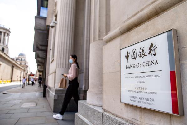 A woman leaves the Bank of China in London, England, on July 21, 2020. (Luke Dray/Getty Images)