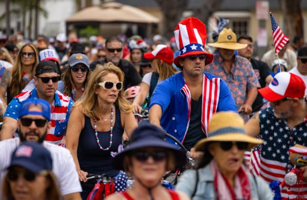 Patriotic locals take part in the 4th Annual 4th of July Bicycle Cruise in Huntington Beach, Calif., on July 1, 2023. (John Fredricks/The Epoch Times)