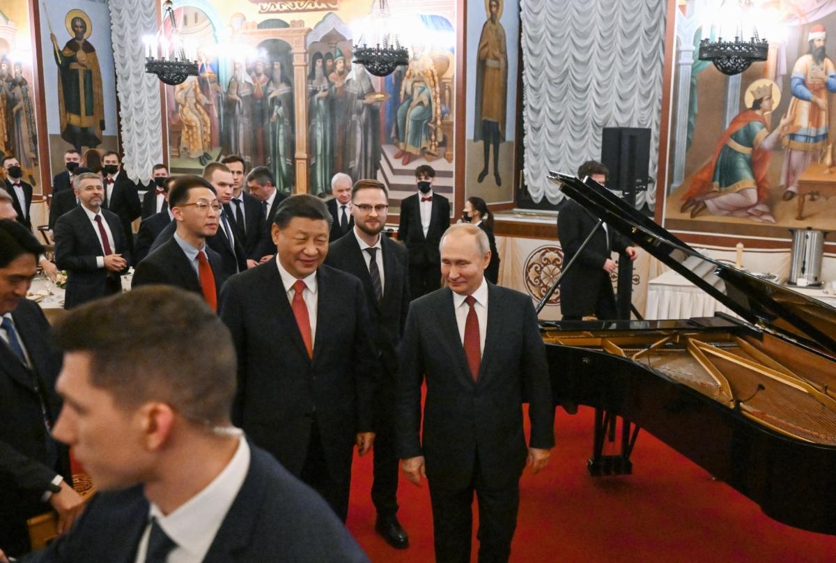 Russian President Vladimir Putin and Chinese leader Xi Jinping leave after a reception following their talks at the Kremlin in Moscow on March 21, 2023. (Grigory Sysoyev/Sputnik/AFP via Getty Images)