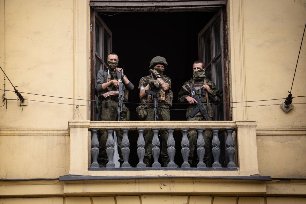 Members of the Wagner Group stand on the balcony of the circus building in the city of Rostov-on-Don, Russia, on June 24, 2023. (Roman Romokhov/AFP via Getty Images)