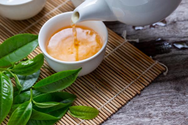 Sipping on a cup of green tea after a meal is a simple way to freshen breath (artphotoclub/Shutterstock)