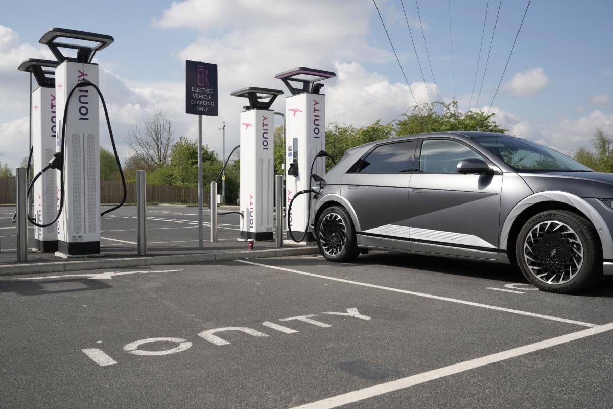 A Hyundai Ioniq electric vehicle charges at an Ionity GmbH electric car charging station at Skelton Lake motorway service area in Leeds, England, on April 26, 2022. (Christopher Furlong/Getty Images)