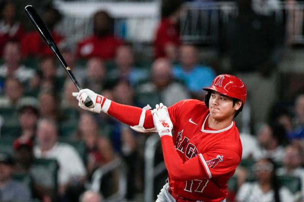 Los Angeles Angels' Shohei Ohtani hits a single in the seventh inning of a baseball game against the Atlanta Braves in Atlanta on July 31, 2023. (John Bazemore/AP Photo)