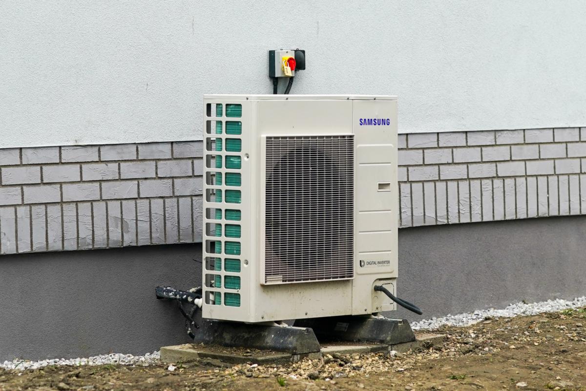 A heat pump stands outside a property as part of a green housing project retrofitted by Kirklees Council, in Huddersfield, England, on March 16, 2022. (Ian Forsyth/Getty Images)