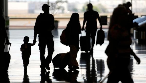 People travel through Salt Lake City International Airport in Salt Lake City on June 30, 2023. (Rick Bowmer/AP Photo)