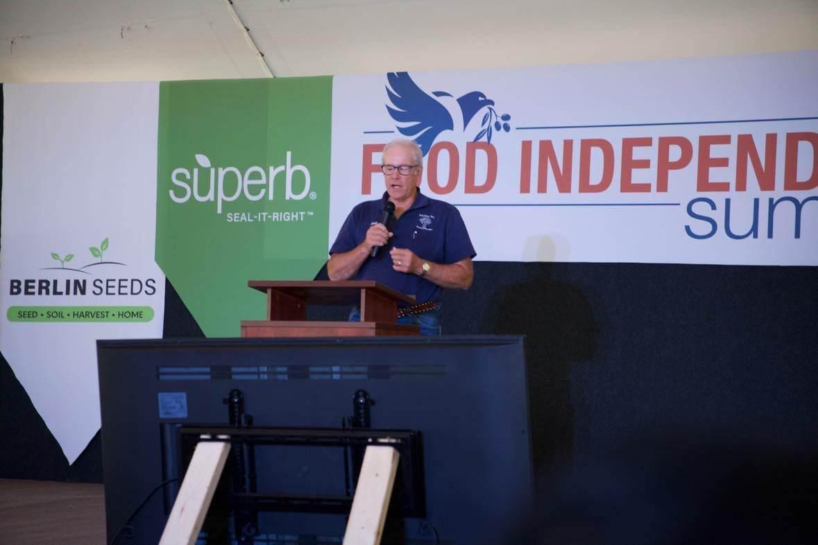 Joel Salatin, owner of Polyface Farm in Virginia, talks about how to inspire kids working with parents at the Food Independence Summit. (Courtesy of Everitt Townsend)