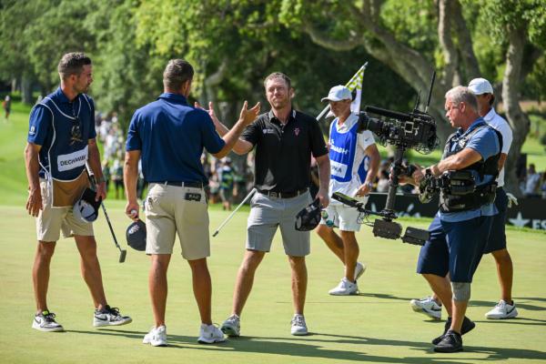 Talor Gooch of RangeGoats GC greets Bryson DeChambeau of Crushers GC on the 18th hole during day three of LIV Golf—Andalucia at Real Club Valderrama in Cadiz, Spain, on July 2, 2023. (Octavio Passos/Getty Images)