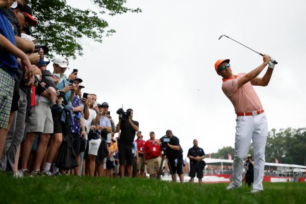 Rickie Fowler of the United States plays his shot on the tenth hole during the final round of the Rocket Mortgage Classic at Detroit Golf Club in Detroit on July 2, 2023. (Cliff Hawkins/Getty Images)