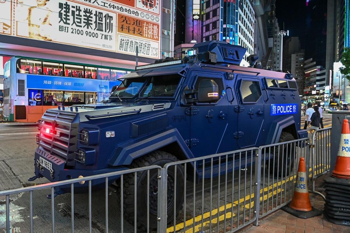 Police armored vehicles stood guard on the streets of Causeway Bay from dawn till late night. July 1, 2023. (Sung Pi-Lung/The Epoch Times)
