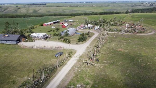 Tornado-damaged homes are seen near Carstairs, Alta., July 1, 2023. (The Canadian Press/Jeff McIntosh)