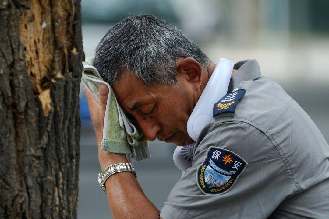 Flooding Displaces 10,000 Around China as Beijing Gets a Relative Respite From Sweltering Heat