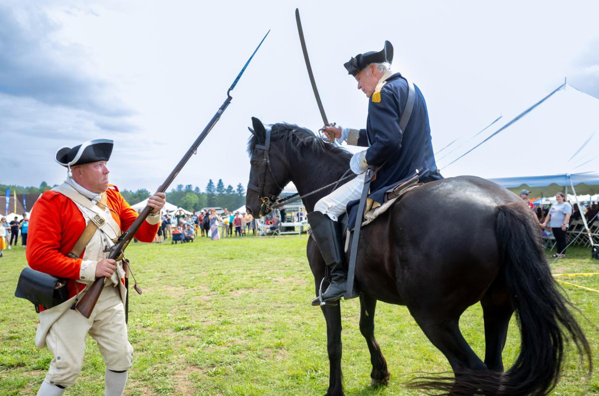 A musket and sword demonstration at the America the Beautiful Festival in Deerpark, N.Y., on July 2, 2023. (Mark Zou/The Epoch Times)