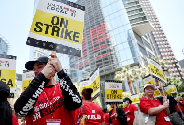 Hotel workers with Unite Here Local 11 picket outside the InterContinental hotel on the first day of a strike at many major hotels in Los Angeles on July 2, 2023. (Mario Tama/Getty Images)