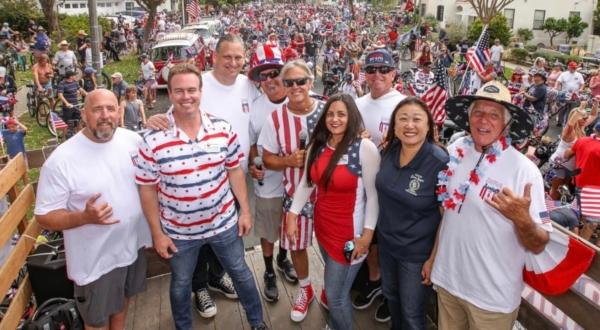 Huntington Beach officials stand with event organizers for the 4th Annual 4th of July Bicycle Cruise in Huntington Beach, Calif., on July 2, 2023. (Courtesy of Rick Brown)