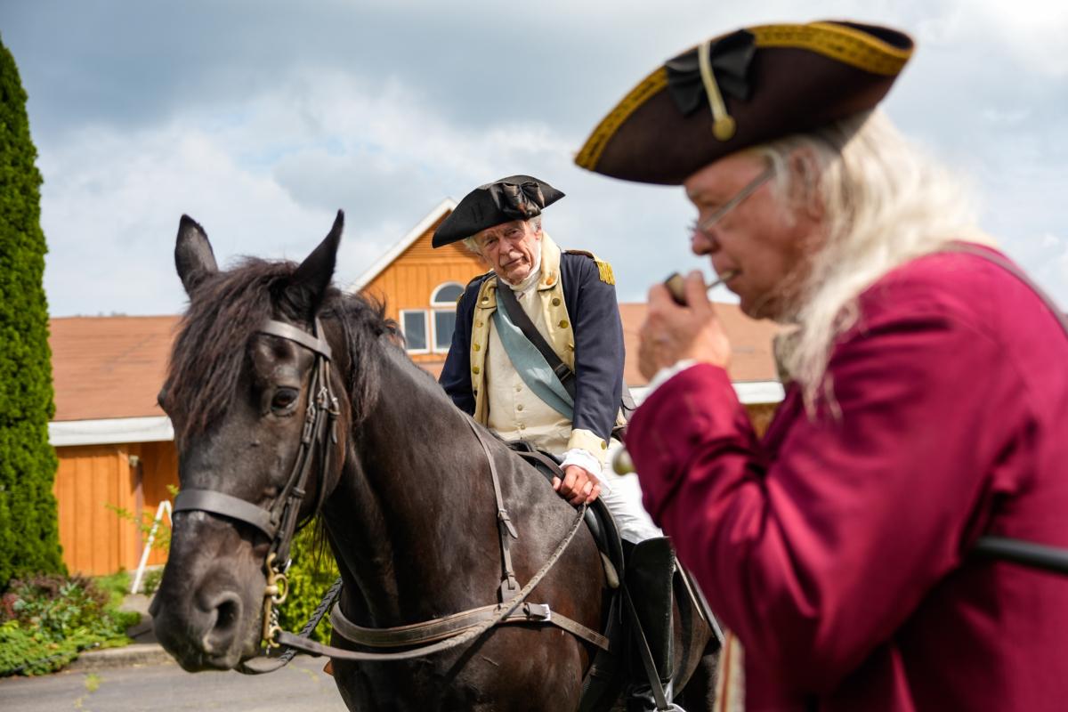 George Washington and Benjamin Franklin reenactors at the America the Beautiful Festival in Deerpark, N.Y., on July 2, 2023. (Samira Bouaou/The Epoch Times)