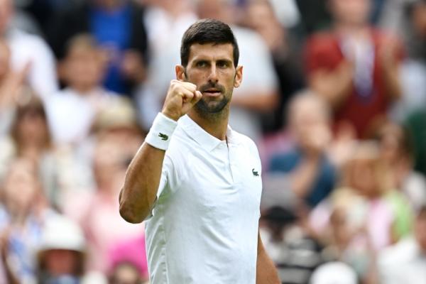 Novak Djokovic of Serbia celebrates winning a match point against Pedro Cachin of Argentina in the men's singles first-round match on day one of The Championships Wimbledon 2023 at All England Lawn Tennis and Croquet Club in London on July 3, 2023. (Shaun Botterill/Getty Images)