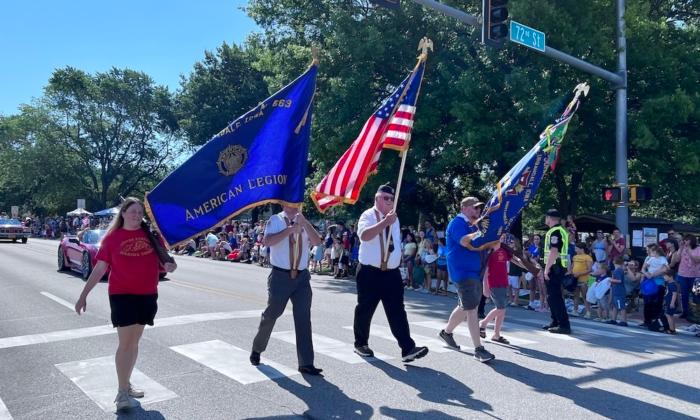 A color guard marches in the 4th of July parade in Urbandale, Iowa, 2023. (Lawrence Wilson/The Epoch Times)