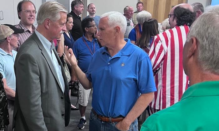 Former Vice President Mike Pence speaks engages with attendees at a campaign event in Boone, Iowa, on July 4, 2023. (Lawrence Wilson/The Epoch Times)