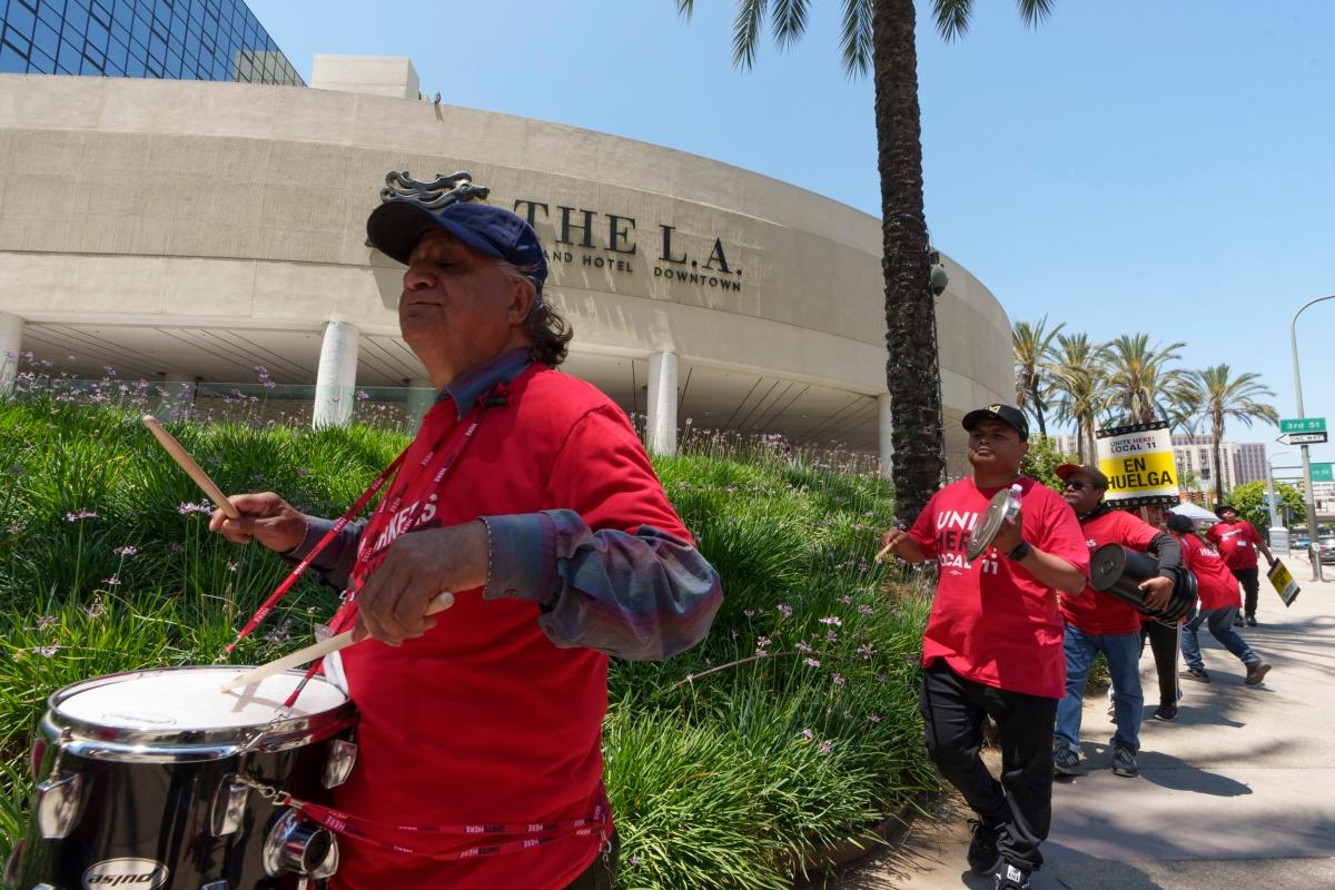Striking hotel workers rally outside The L.A. Grand Hotel Downtown in downtown Los Angeles on July 4, 2023. (Damian Dovarganes/AP Photo)