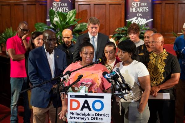 Josephine Wamah, center left, with Jasmine Wamah, center right, sisters of shooting victim Joseph Wamah Jr., speaks about their brother at a news conference at Salt and Light Church in Philadelphia on July 5, 2023. (Allie Ippolito/The Philadelphia Inquirer via AP)