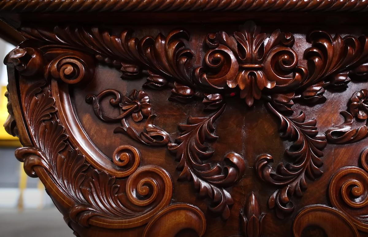 Ornate floral designs and roses are carved into the exterior of the desk. (Courtesy of <a href="https://rauantiques.com/">M.S. Rau, News Orleans</a>)