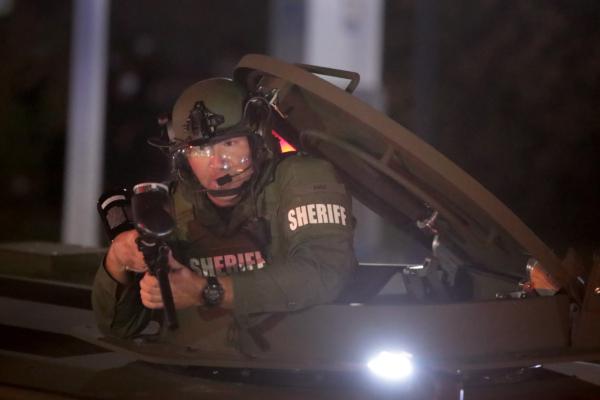 In an image taken by Scott Olson, police fire pepper balls from an armored vehicle as they confront demonstrators outside of the Kenosha County Courthouse during a third night of unrest in Kenosha, Wisconsin, on Aug. 25, 2020. (Scott Olson/Getty Images)