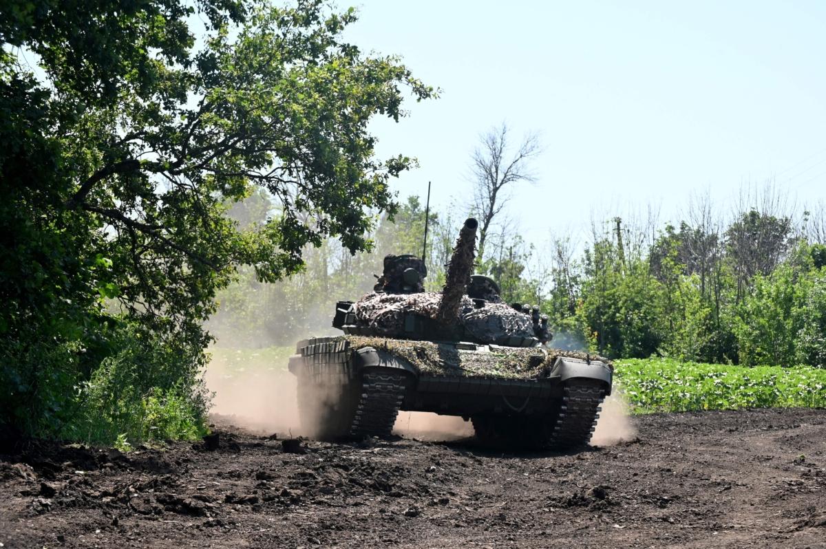  Ukrainian servicemen ride on a tank not far from the front line in the Kharkiv region, on July 6, 2023, amid the Russian invasion of Ukraine. (Sergey Bobok/AFP via Getty Images)