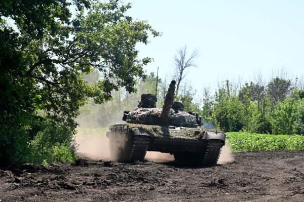 Ukrainian servicemen ride on a tank not far from the front line in the Kharkiv region amid the continuing Russian invasion of Ukraine on July 6, 2023. (Sergey Bobok/AFP via Getty Images)
