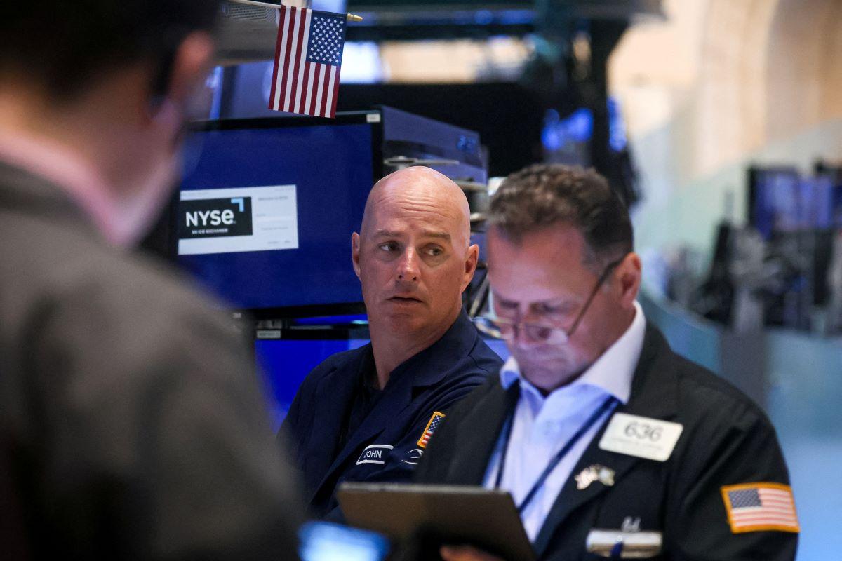 Traders work on the floor of the New York Stock Exchange (NYSE) in New York City on July 6, 2023. (Brendan McDermid/Reuters)
