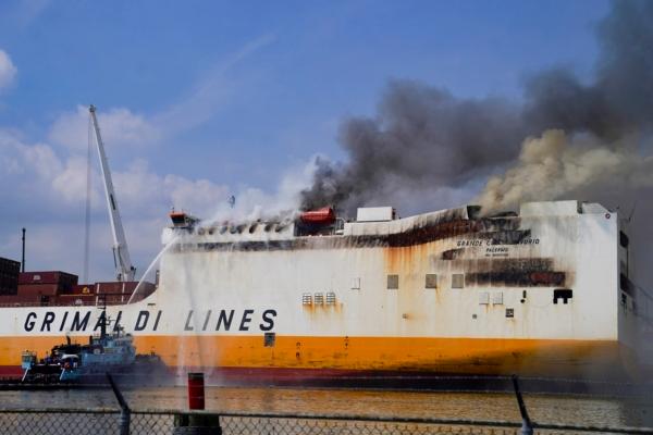 Emergency personnel battle against a fire aboard the Italian-flagged Grande Costa d'Avorio cargo ship at the Port of Newark in Newark, N.J., on July 7, 2023. (John Minchillo/AP Photo)