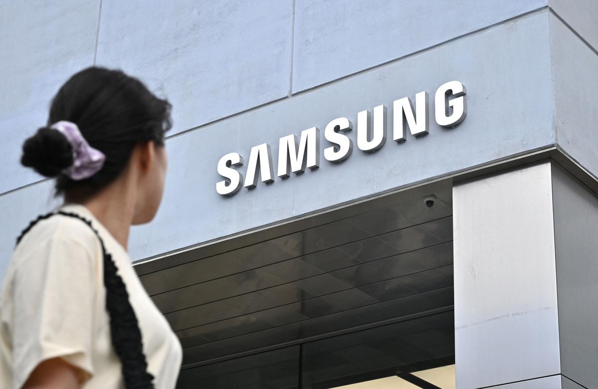 A woman walks past a new flagship store of Samsung Electronics in the Gangnam district in Seoul on June 28, 2023. (Jung Yeon-je/AFP via Getty Images)