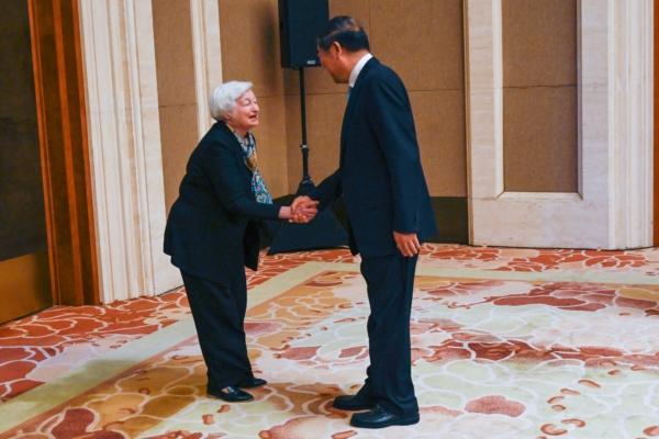 U.S. Treasury Secretary Janet Yellen (L) shakes hands with Chinese Vice Premier He Lifeng during a meeting at the Diaoyutai State Guesthouse in Beijing on July 8, 2023. (Pedro Pardo/POOL/AFP via Getty Images)