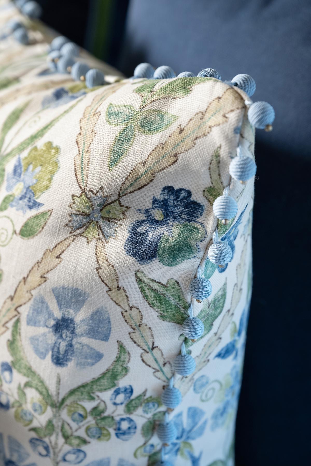 Bauble trim dazzles in this blue and green new traditional bed pillow. (Provided photo/TNS)