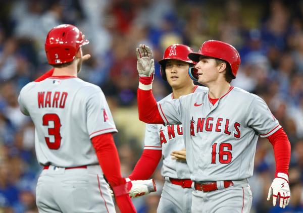 Mickey Moniak (16) of the celebrates a three-run home run with Taylor Ward (3) of the Los Angeles Angels against the Los Angeles Dodgers in the fourth inning at Dodger Stadium in Los Angeles on July 7, 2023. (Ronald Martinez/Getty Images)