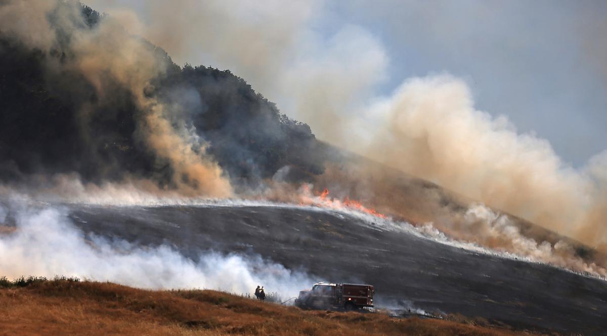 The San Antonio Fire spreads uphill west of Petaluma, Calif., on June 30, 2023. (Kent Porter/The Press Democrat via AP)