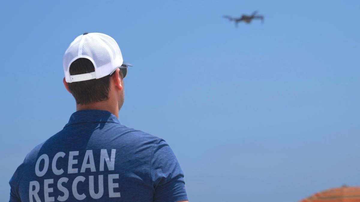 Cary Epstein, lifeguarding supervisor, monitors the waters from above as he operates a drone for a shark patrol flight at Jones Beach State Park in Wantagh, N.Y., on July 6, 2023. (John Minchillo/AP Photo)