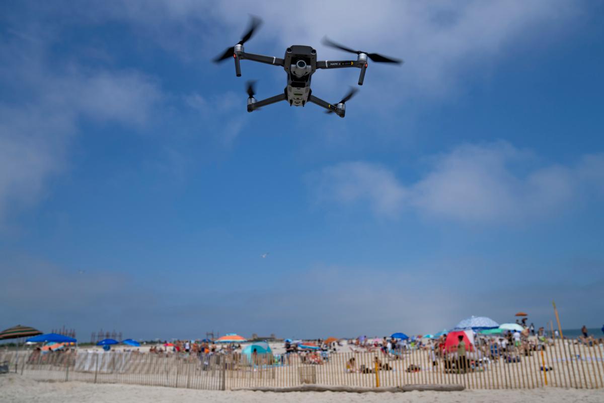 A drone is flown in for a landing after a shark patrol flight at Jones Beach State Park in Wantagh, N.Y., on July 6, 2023. (John Minchillo/AP Photo)