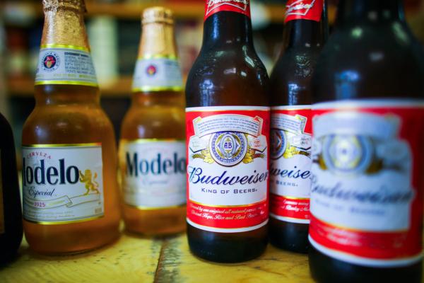 Bottles of Anheuser-Busch Budweiser and Grupo Modelo beers are displayed in Miami, Fla., on Jan. 31, 2013. (Joe Raedle/Getty Images)