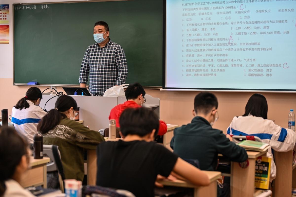 A teacher wearing a face mask is seen during a government-organised media tour at Shanghai High School after it reopened in Shanghai on May 7, 2020. (Hector Retamal/AFP via Getty Images)