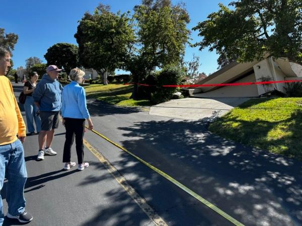 LA County Supervisor Janice Hahn stands with homeowners watching their houses sink from a landslide in Rolling Hills Estates in Los Angeles County, Calif., on July 9, 2023. (Courtesy of Los Angeles County Supervisor Janice Hahn)
