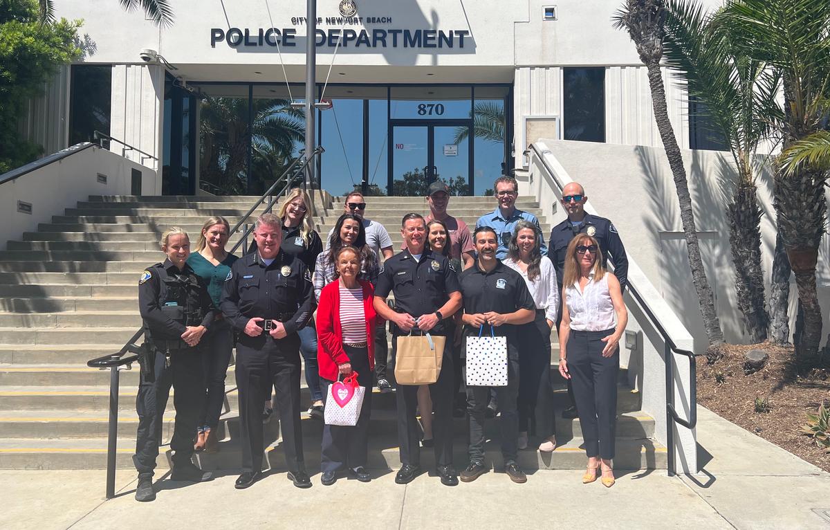 Dotty McDonald (C), a 94-year-old local resident, gives gift cards to the Newport Beach Police Department in Newport Beach, Calif., on July 5, 2023. (Courtesy of Logan Edwards)