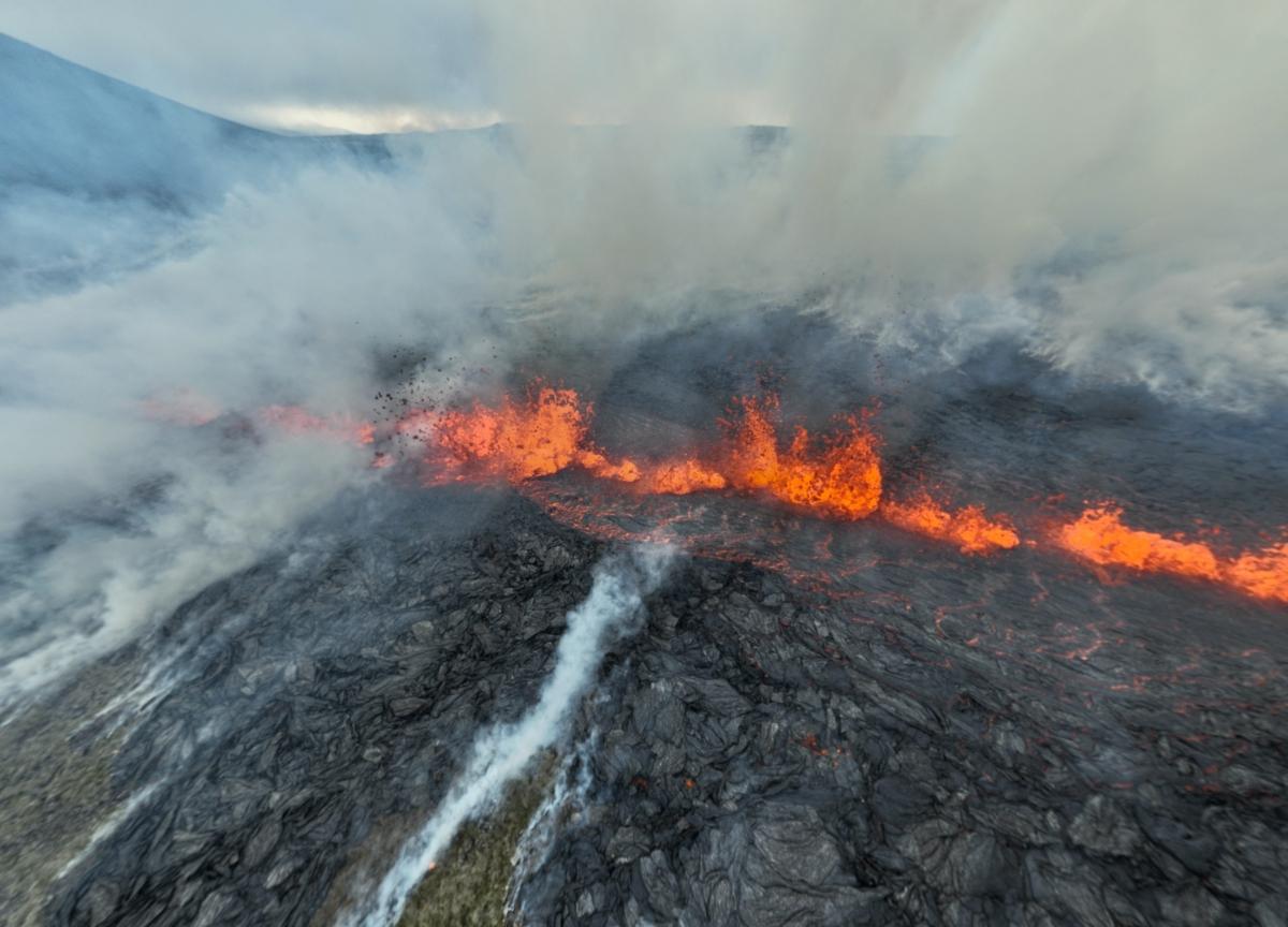 Smoke billows and lava spurts after the eruption of a volcano, on the Reykjanes peninsula, near the capital Reykjavik, in southwest Iceland, July 10, 2023. (Juergen Merz/Glacier Photo Artist via Reuters)